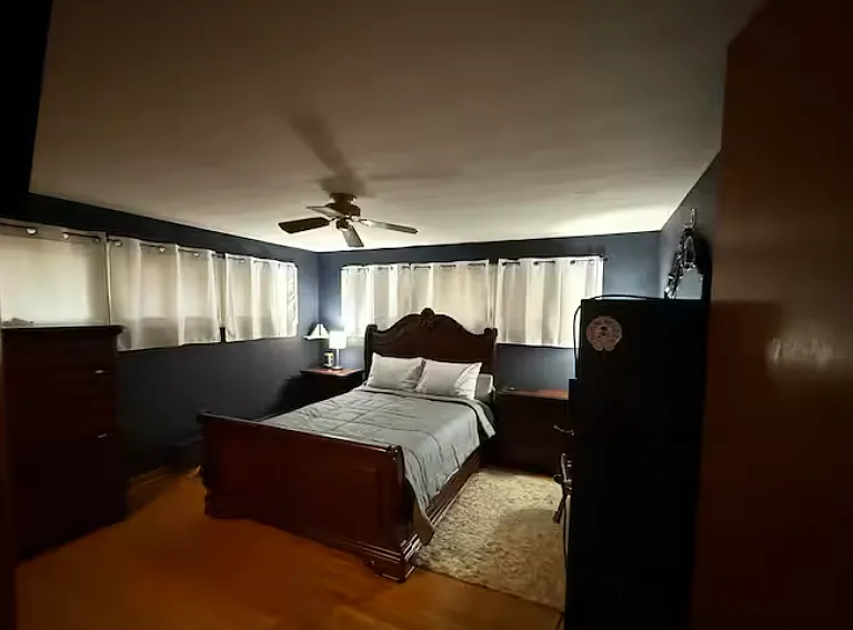 Spacious master bedroom with large windows, ample natural light, and room for full bedroom furnishings.