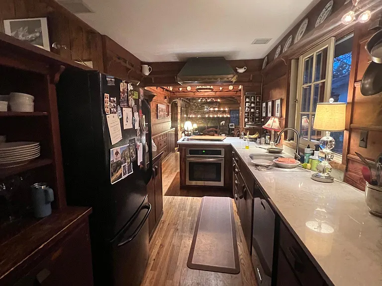 updated kitchen counters combine with antique original woods