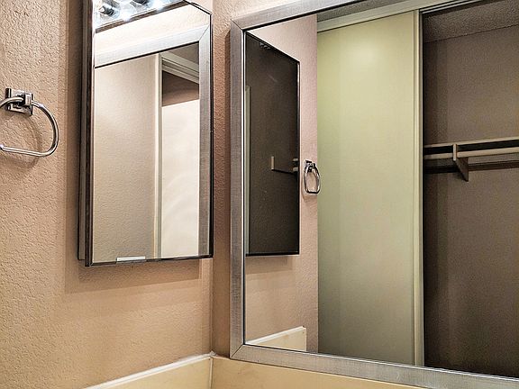 Framed vanity mirrors in bathrooms