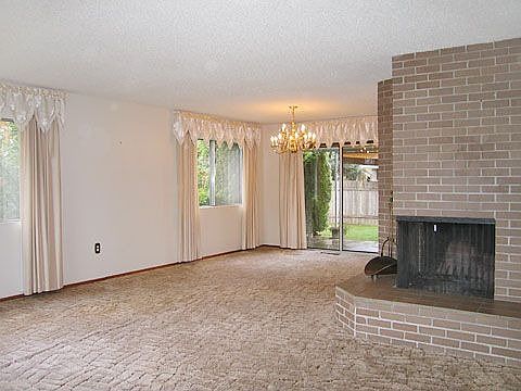 Living room with corner fireplace