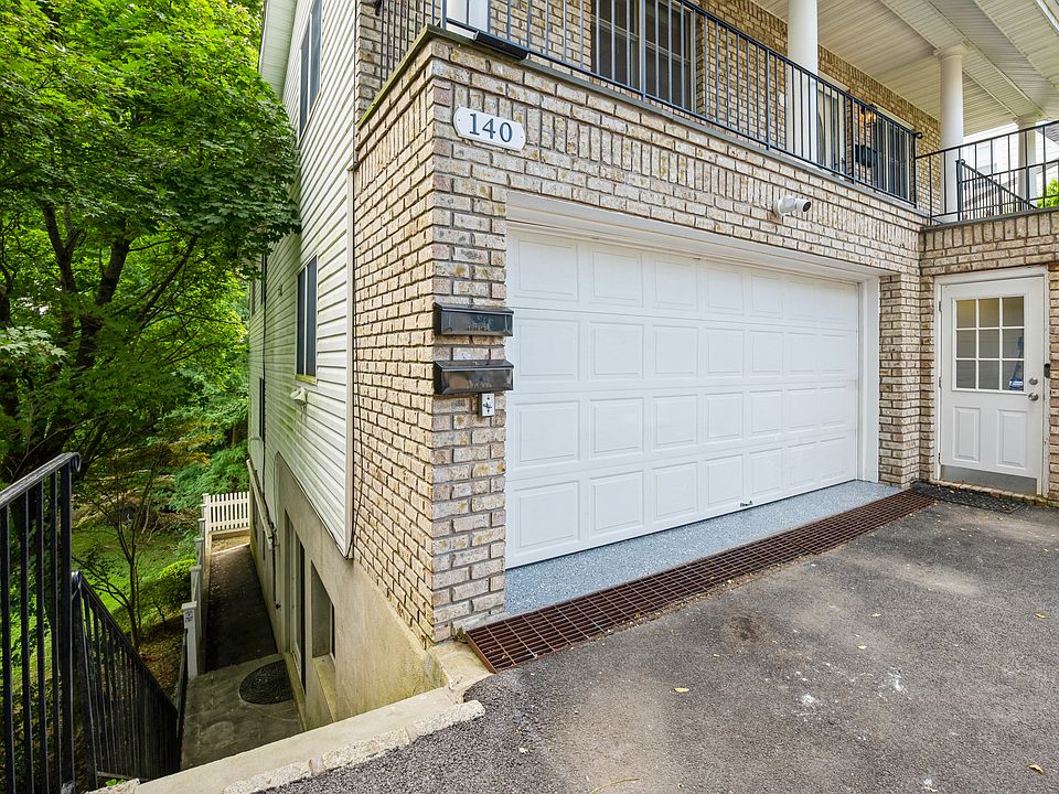 Steps down to apartment entrance and backyard.