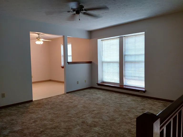 Going upstairs to living room and looking into kitchen.