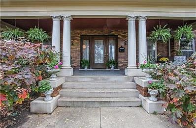 Limestone pillars welcome you to the expansive front porch.