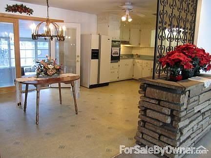 Large Country Kitchen : French doors lead to Sunroom, view of backyard. Pantry and basement door nea