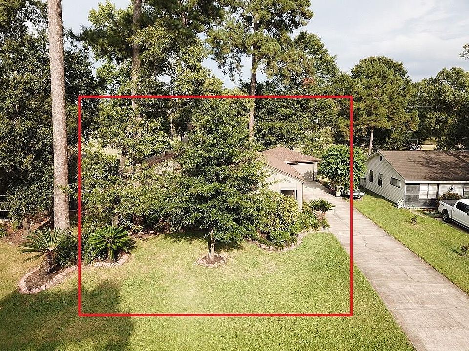 Aerial view of home under a canopy of trees!