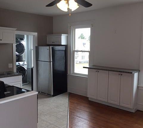 living area with built-in bar height counter