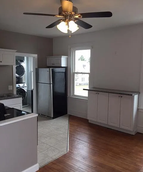 living area with built-in bar height counter