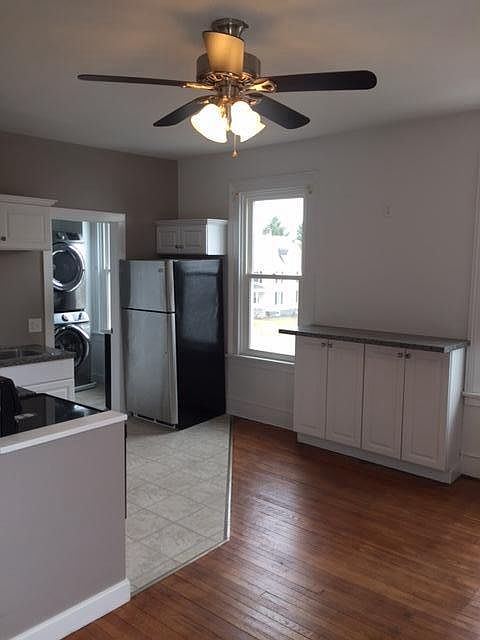 living area with built-in bar height counter