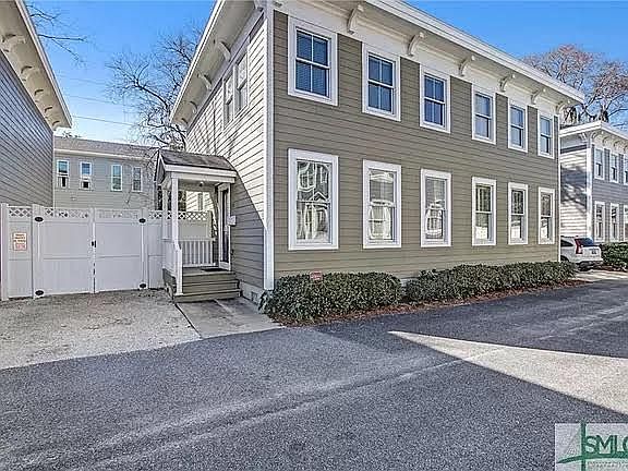 Exterior of the home with designated parking space.