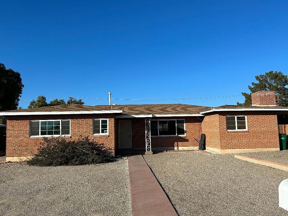 Front with carport and off street parking