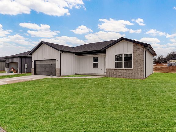 Lawn is digitally added due to being new construction.