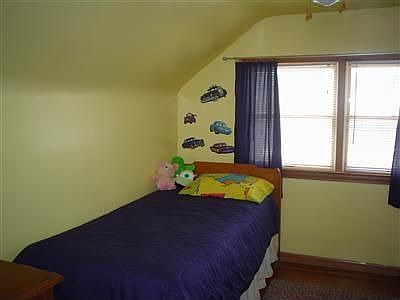 COZY BEDROOM WITH CHARACTER. COULD BE USED AS A PRIVATE DEN OR OFFICE.