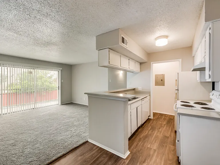 A bright kitchen and dining area create the perfect gathering place.