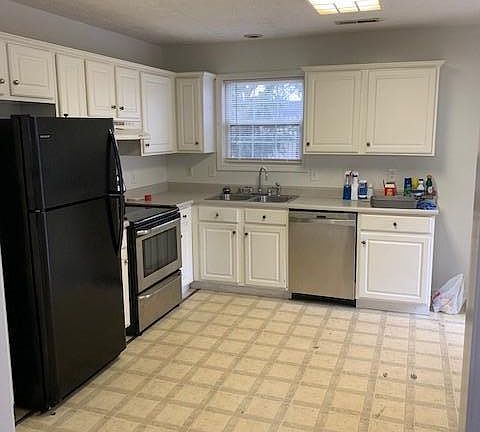 Kitchen with disposal and dishwasher