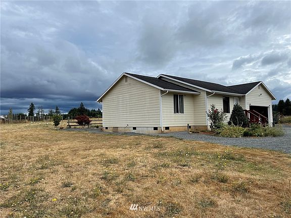 Side view of the home. Built in 2000 with low maintenance features such as cement plank siding. 