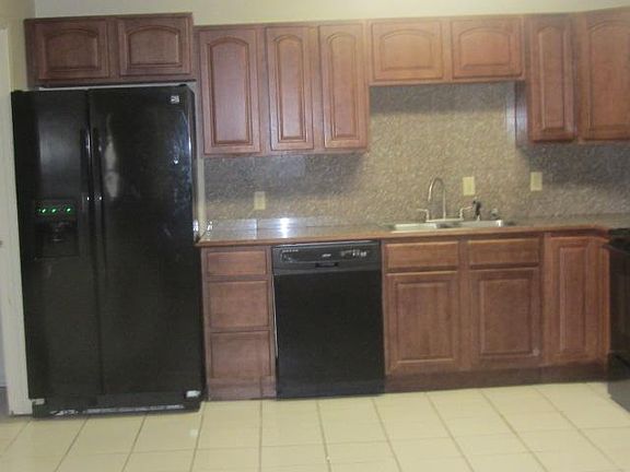 Large Kitchen/ Dining Room Side by side Refrigerator Freezer with Ice & water in the Door, Dishwasher, Built in Microwave Stove with self cleaning oven.