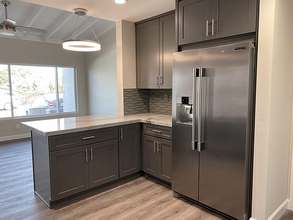 Kitchen, living room window in distance