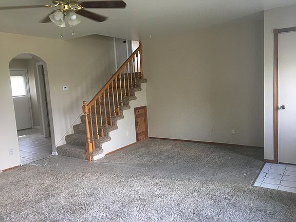 Great room with staircase leading to upper level