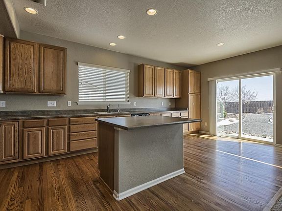 Kitchen has lots of cabinet space and center island