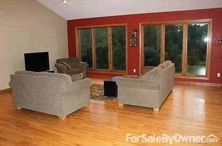 Living Room
						:
						Floor to ceiling windows provide great view of the backyard and woods.