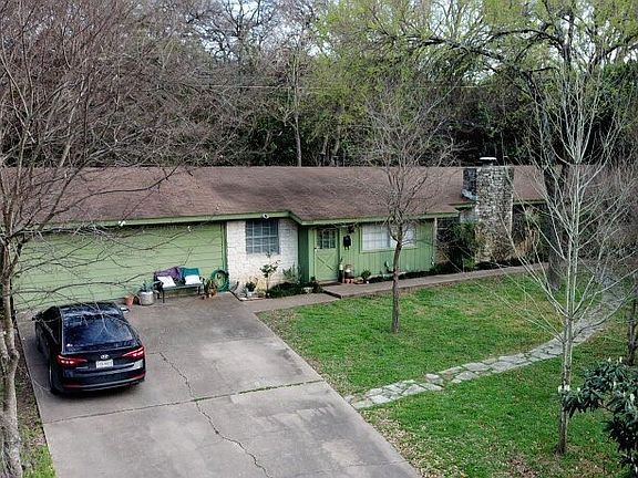 Front of the duplex with driveway