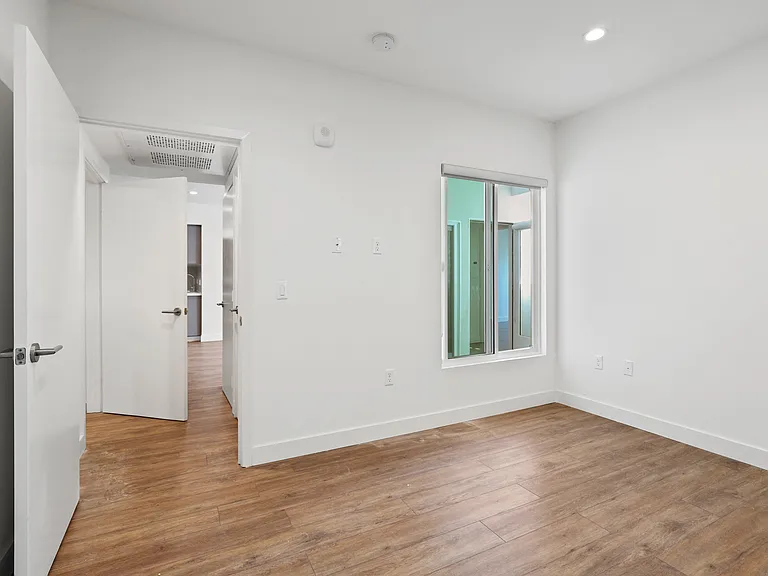 Bedroom with Vinyl Flooring, Recessed Lighting, and Window