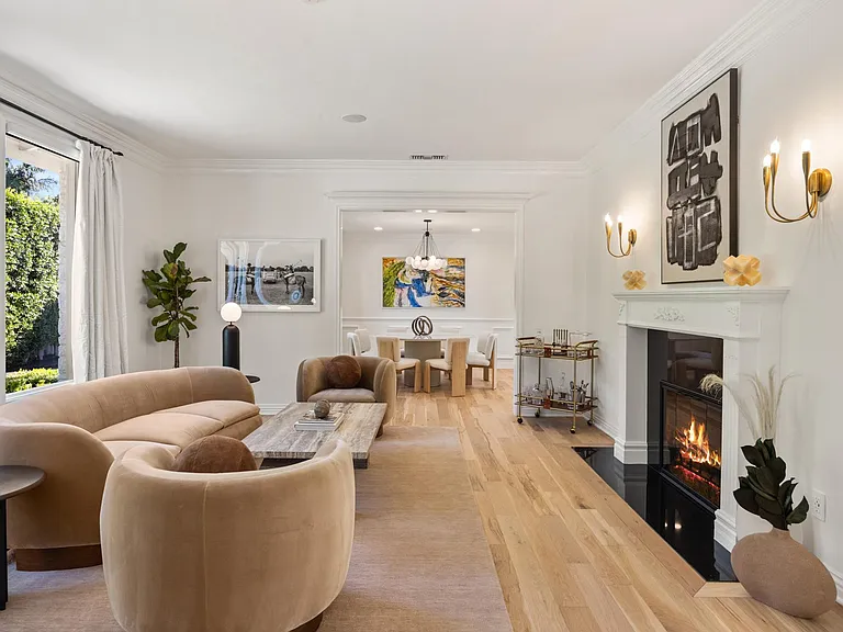 The living space with a fireplace invites cozy moments and elegant relaxation.