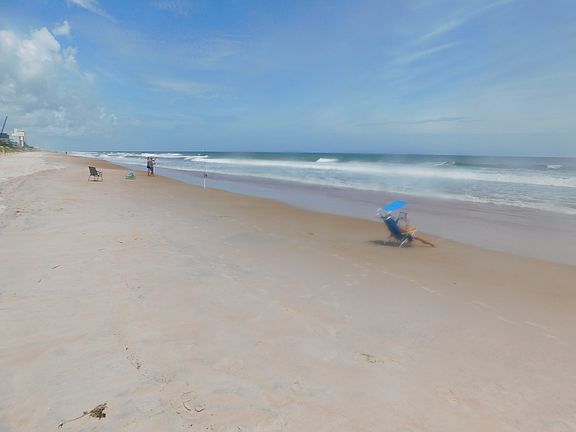 Gently sloping clean Beach. Shower rinse station, Portable sanity facility