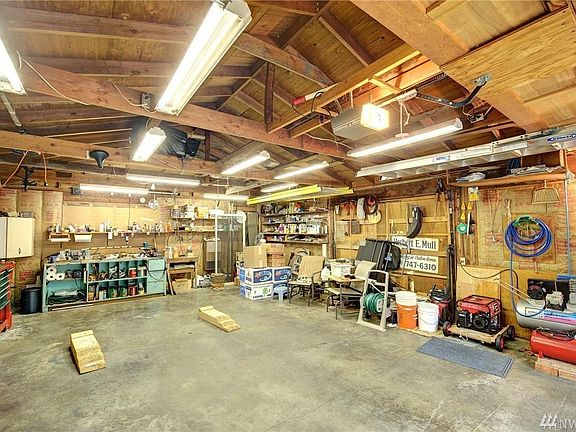 Detached garage with heat behind house