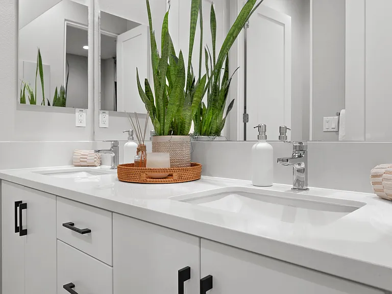 The Jack and Jill bathroom features double vanity sinks for your convenience.