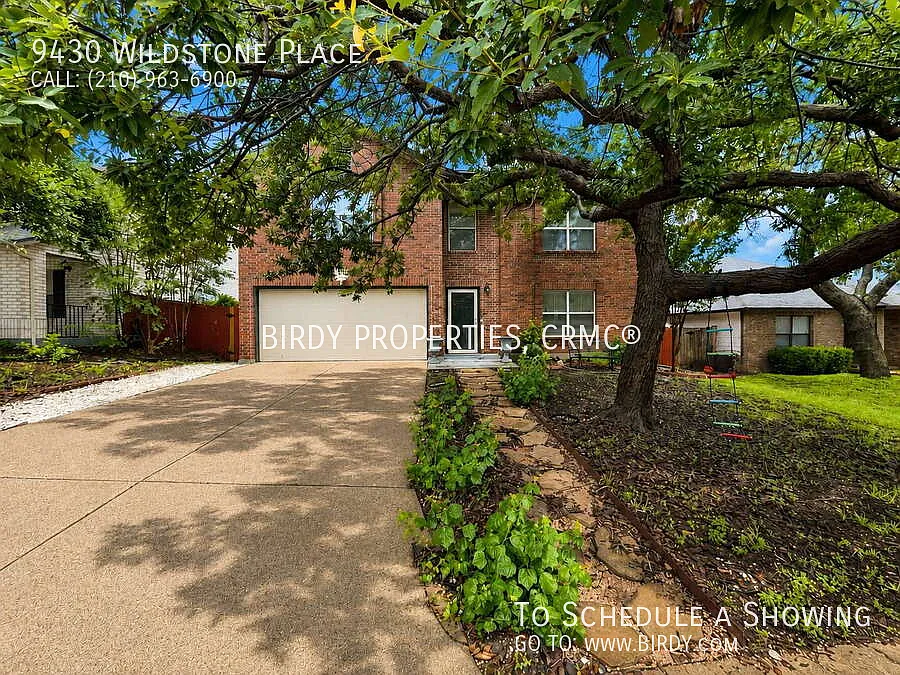 "Spacious 4-Bedroom Sanctuary with Fireplace at 9430 Wildstone Place!" — Photo 2