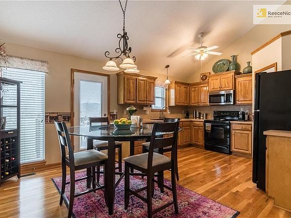 Large eat-in kitchen with hardwood floors.