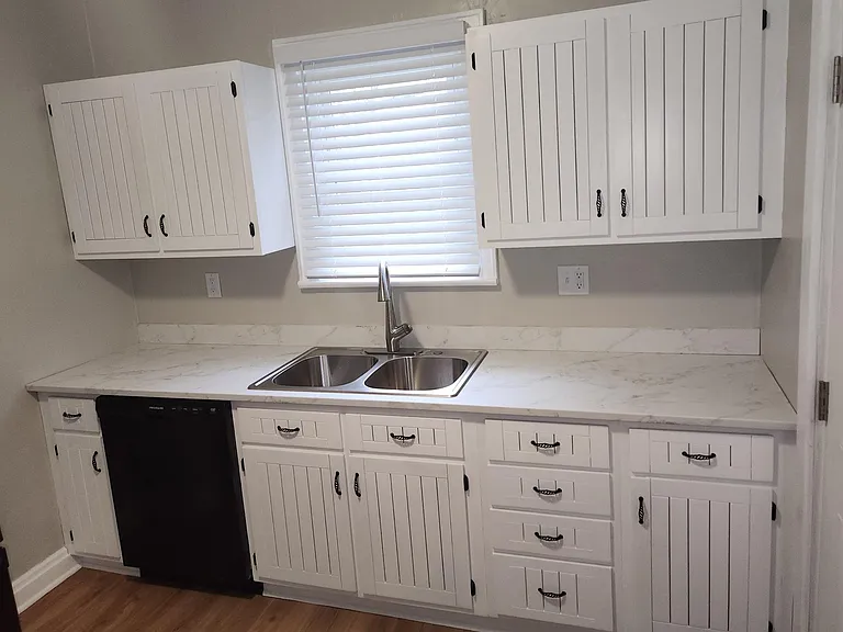 Newly installed remodeled cabinets; new dishwasher, microwave, refrigerator; new luxury vinyl floor; one window with new wide cordless blind