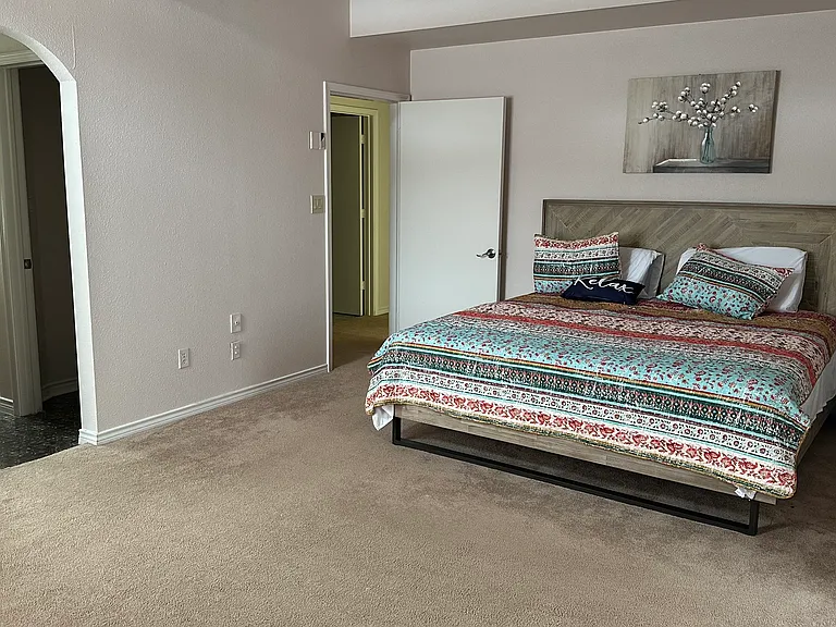 Master bedroom w fireplace has walk in closet and full bathroom with shower