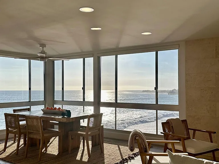 Embrace the serene beauty of a calm sunset in the living space, casting a soothing ambiance.