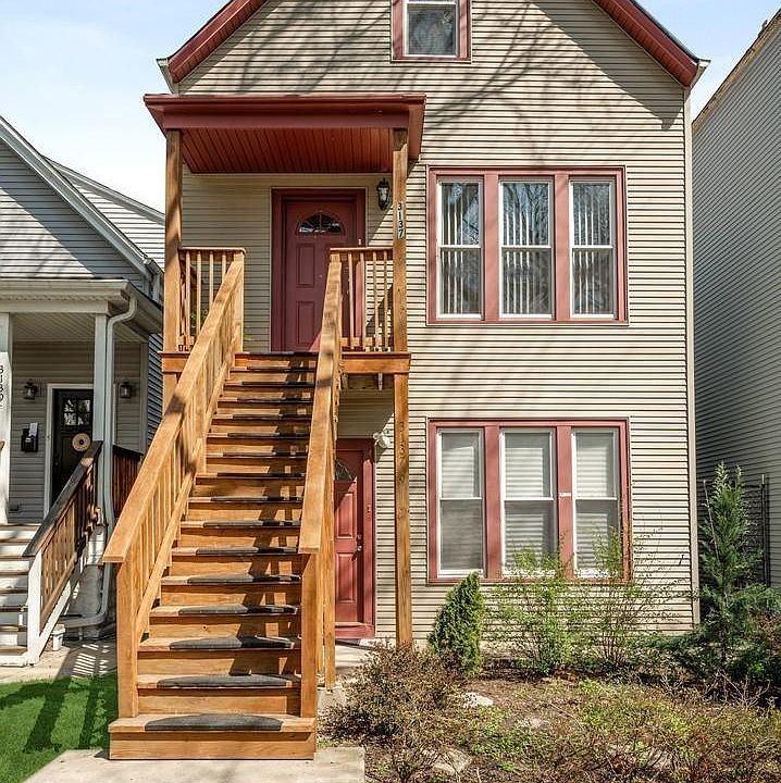 Front of house. Apartment is up the stairs.