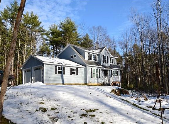 front of the house where you can see the driveway and front yard.