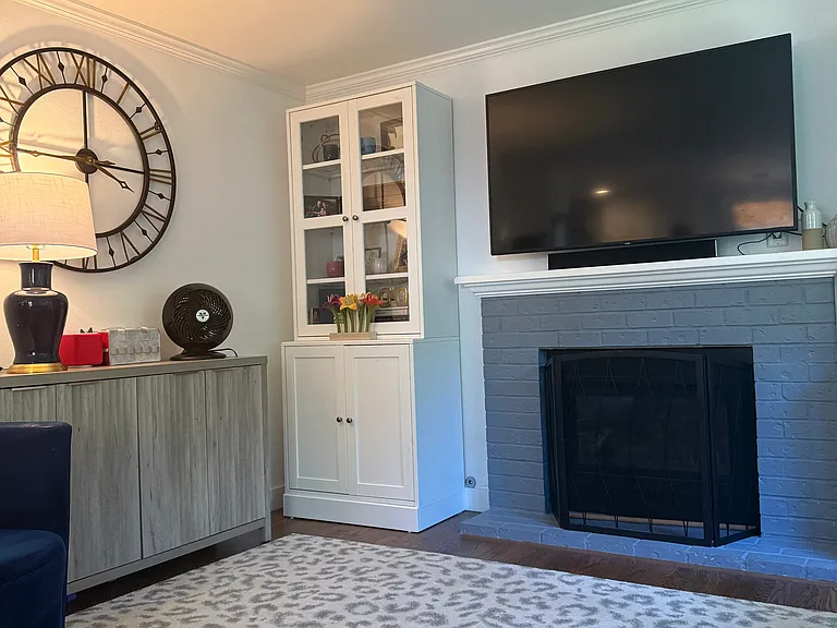 Light-filled Living Room with Gas Fireplace and big windows.