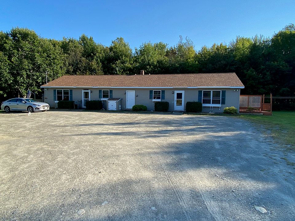 Front of Building. Unit available is on the right. Surrounded by trees and lots of parking.