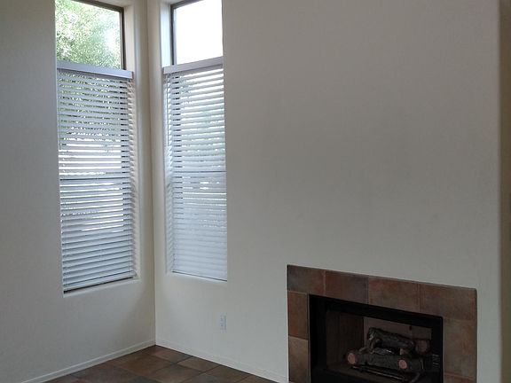 Living room with vaulted ceilings and gas fire place