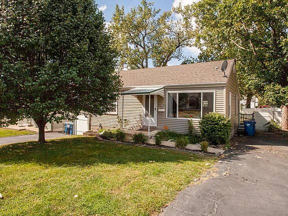 The drive leads to a fenced yard just perfect for children, pets, or entertaining.