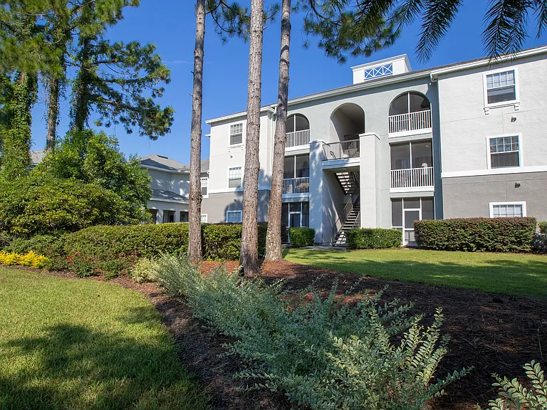 Discover the allure of our apartment building exterior, adorned by nature's vibrant elegance and embraced by flourishing greenery. Experience life at Banyan Bay, where lush landscaping makes everyday living a pleasure.