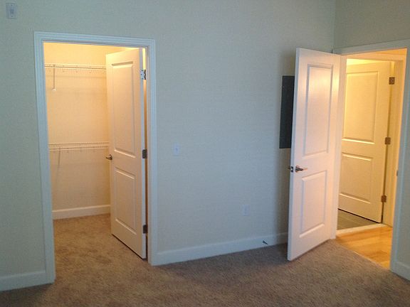 master bedroom with walk-in closet