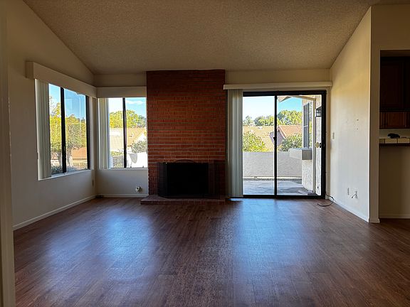 living room fireplace view from den