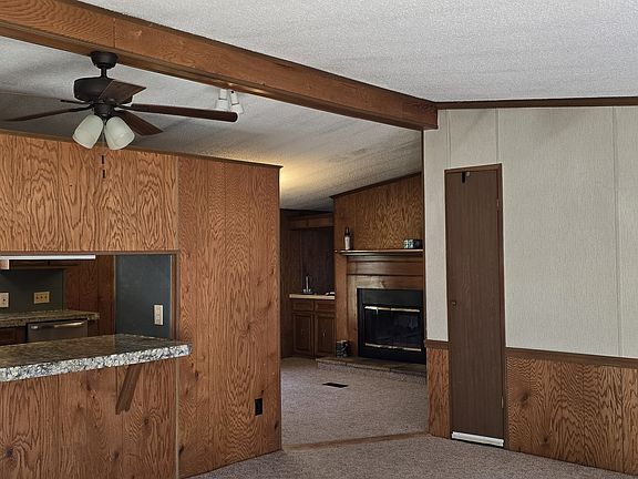 Living room looking into kitchen and dining room