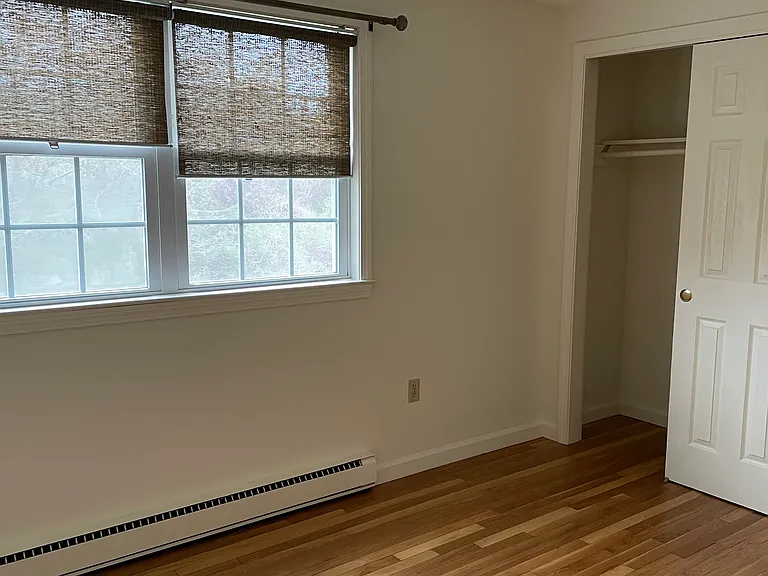 view from opposite side of smaller bedroom