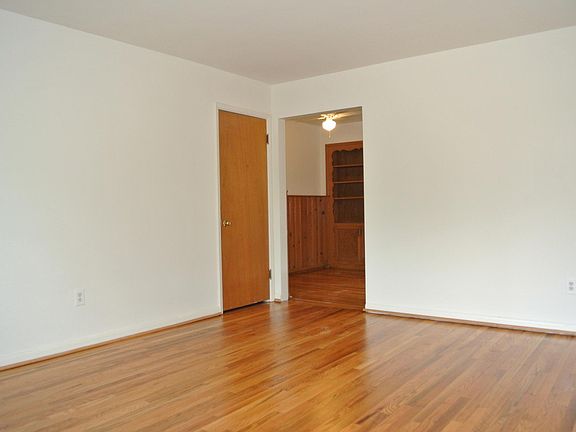 Living room looking into dining/desk area.