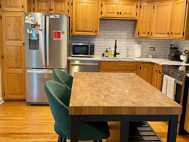 kitchen with stainless appliances, espresso/coffee maker, all cooking and serving items and 2 person bar