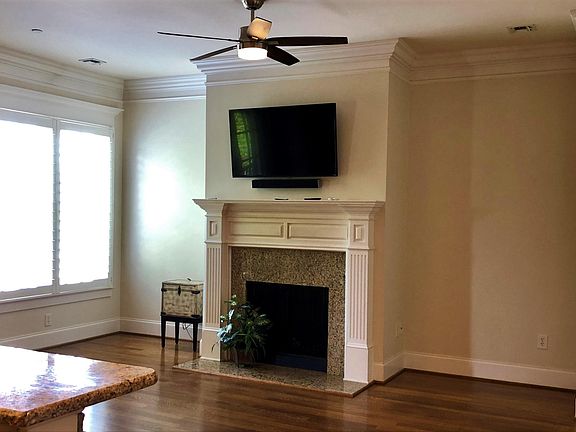 Open living area with wall mounted television