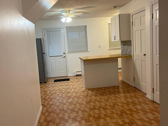 Open concept L shaped kitchen and living room